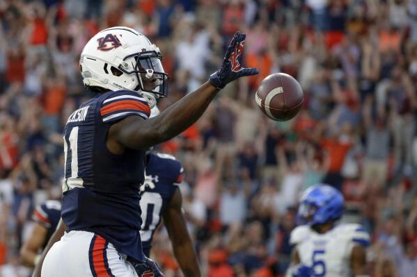 Auburn wide receiver Shedrick Jackson (11) celebrates after he catches a pass for a touchdown over Georgia State cornerback Quavian White (20) to take the lead in the final minute of the second half of an NCAA football game Saturday, Sept. 25, 2021, in Auburn, Ala. Auburn won 34-24. (AP Photo/Butch Dill)