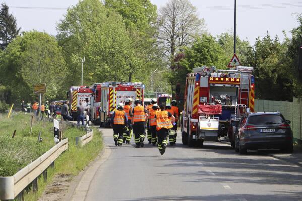 A large contingent of rescue workers is on duty after a serious train accident in Huerth, Germany, Thursday, May 4, 2023. Two people have been killed and several were injured in a train accident near the western German city of Cologne. German news agency dpa reported that the train supposedly crashed into a group of people who were working on the tracks close to the town of Huerth on Thursday. (Sebastian Klemm/dpa via AP)