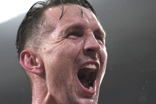 PSV's Luuk de Jong celebrates after scoring his side's opening goal during the Champions League, Group B soccer match between PSV Eindhoven and Lens, at Philips stadium in Eindhoven, Netherlands, Wednesday, Nov. 8, 2023. (AP Photo/Patrick Post)