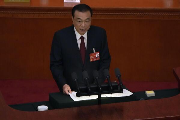 Chinese Premier Li Keqiang speaks during the opening session of China's National People's Congress (NPC) at the Great Hall of the People in Beijing, Sunday, March 5, 2023. (AP Photo/Ng Han Guan)