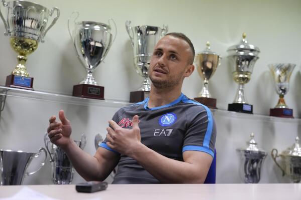 Napoli's Stanislav Lobotka is interviewed by the Associate Press at the end of a training session at the club headquarters in Castel Volturno, near Naples, Wednesday, April 5, 2023. Unlike other major cities in Italy, Naples has only one major soccer team and the fan support for Napoli is felt on every street and alleyway. Lobotka, who developed with Ajax’s junior squad and then played for Danish club Nordsjaelland and Spanish side Celta Vigo before transferring to Italy, had never experienced anything like Napoli.(AP Photo/Gregorio Borgia)
