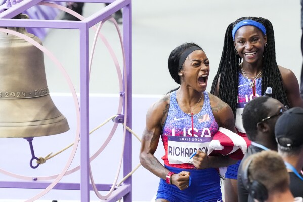 Sha'carri Richardson of the United States, celebrates after winning the women's 4 x 100-meter relay final at the 2024 Summer Olympics, Friday, Aug. 9, 2024, in Saint-Denis, France. (AP Photo/Martin Meissner)