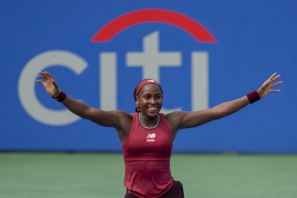 CORRECTS THAT SAKKARI IS FROM GREECE, NOT GERMANY - Coco Gauff, of the United States, celebrates after defeating Maria Sakkari, of Greece, in the women's singles final of the DC Open tennis tournament Sunday, Aug. 6, 2023, in Washington. (AP Photo/Alex Brandon)