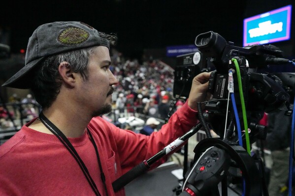 Will Lawrence with Right Side Broadcasting Network prepares for Republican presidential candidate former President Donald Trump to speak in Rome, Ga., on Saturday, March 9, 2024. (AP Photo/Mike Stewart)