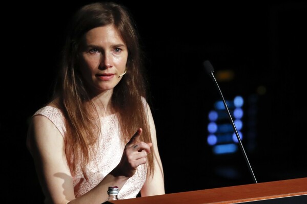 Amanda Knox speaks at a Criminal Justice Festival at the University of Modena, Italy, Saturday, June 15, 2019. Knox faces yet another trial for slander in a case that could remove the last remaining guilty verdict against her nine years after Italy's highest court definitively threw out her conviction for the murder of her 21-year-old British roommate, Meredith Kercher. (AP Photo/Antonio Calanni)