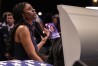 A mourner stands at the casket of slain airman Roger Fortson during his funeral at New Birth Missionary Baptist Church, Friday, May 17, 2024, near Atlanta. (AP Photo/Brynn Anderson)