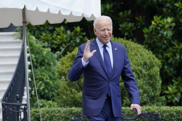 President Joe Biden tries to hear questions shouted by reporters as he heads to Marine One on the South Lawn of the White House in Washington, Friday, July 16, 2021, to spend the weekend at Camp David. (AP Photo/Susan Walsh)