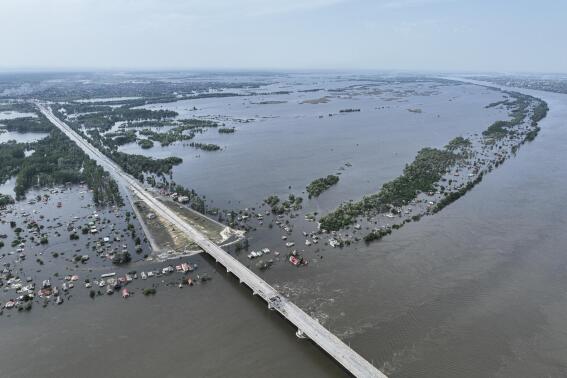Houses are seen underwater in the flooded village near Kherson, Ukraine, Saturday, June 10, 2023. The destruction of the Kakhovka Dam in southern Ukraine is swiftly evolving into long-term environmental catastrophe. It affects drinking water, food supplies and ecosystems reaching into the Black Sea. (AP Photo)