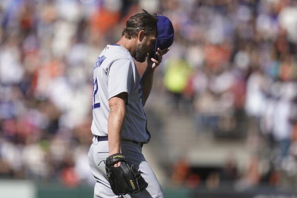 Los Angeles Dodgers pitcher Clayton Kershaw reacts after San Francisco Giants' Luis Gonzalez hit an RBI single during the second inning of a baseball game in San Francisco, Saturday, June 11, 2022. (AP Photo/Jeff Chiu)
