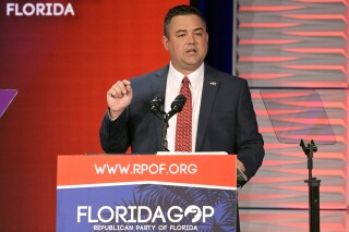 FILE - Republican Party of Florida Chairman Christian Ziegler addresses attendees at the Republican Party of Florida Freedom Summit, Saturday, Nov. 4, 2023, in Kissimmee, Fla. Police cleared Ziegler, the ousted chair of the Florida Republican Party, of rape allegations on Friday, Jan 19, 2024, but said they have asked prosecutors to charge him with illegally video recording the sexual encounter he had with a female acquaintance. (AP Photo/Phelan M. Ebenhack, File)