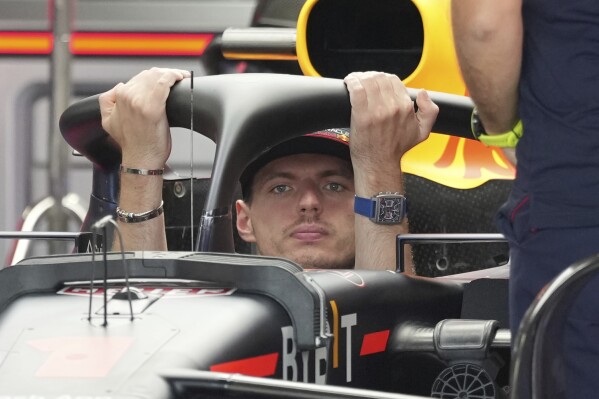 Red Bull driver Max Verstappen of the Netherlands rides on his car at his team garage ahead of the Japanese Formula One Grand Prix at the Suzuka Circuit in Suzuka, central Japan, Thursday, Sept. 21, 2023. (AP Photo/Toru Hanai)