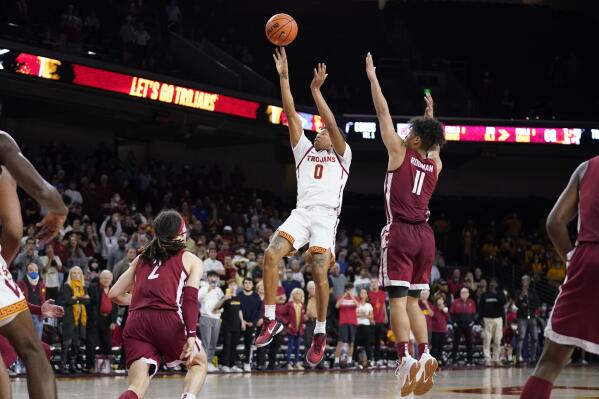 Southern California guard Boogie Ellis (0) makes the go-ahead basket in the closing seconds of a win over Washington State in an NCAA college basketball game Sunday, Feb. 20, 2022, in Los Angeles. (AP Photo/Marcio Jose Sanchez)