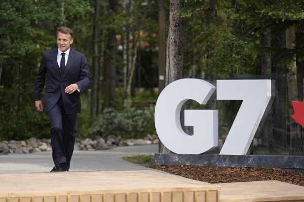 France's President Emmanuel Macron arrives during the official welcome of the G7 Summit, Monday, June 16, 2025, in Kananaskis, Canada. (AP Photo/Mark Schiefelbein)