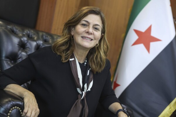 Syrian Minister of Social Affairs and Labor Hind Kabawat, speaks during an interview with the Associated Press, in Damascus, Syria, Monday, May 12, 2025. (AP Photo/Ghaith Alsayed)