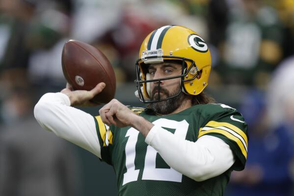 Green Bay Packers' Aaron Rodgers warms up before an NFL football game against the Cleveland Browns Saturday, Dec. 25, 2021, in Green Bay, Wis. (AP Photo/Matt Ludtke)
