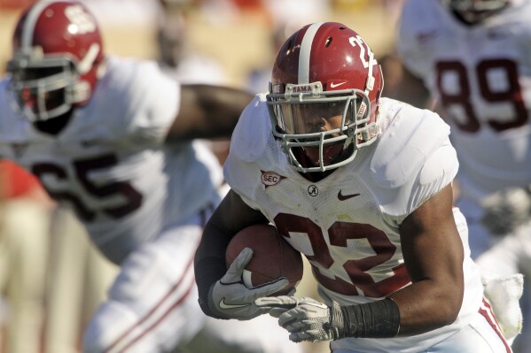 In this Sept. 18, 2010, file phot, Alabama running back Mark Ingram (22) carries the ball during the first quarter of an NCAA college football game against Duke in Durham, N.C. (AP Photo/Sara D. Davis, File)