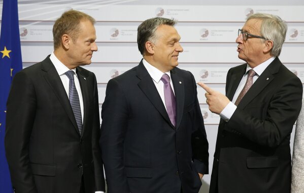 
              FILE - In this May 22, 2015 file photo, European Commission President Jean-Claude Juncker, right, and European Council President Donald Tusk, left, greet Hungary's Prime Minister Viktor Orban during a summit in Riga, Latvia. As the Hungarian prime minister’s conflicts with the European Union appear headed to a breaking point, calls are increasing for greater scrutiny of his government’s spending of EU funds. An opposition lawmaker in Hungary has gathered over 470,000 signatures to pressure Prime Minister Viktor Orban into joining the budding European Public Prosecutor’s Office as Orban’s Fidesz party may be suspended or expelled next week from the main center-right group in the European Parliament, it was announced Thursday, March 14, 2019  (AP Photo/Mindaugas Kulbis, File)
            
