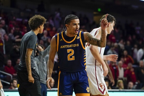 UC Irvine guard Justin Hohn gestures during a timeout during the second half of the team's NCAA college basketball game against Southern California, Tuesday, Nov. 14, 2023, in Los Angeles. (AP Photo/Ryan Sun)