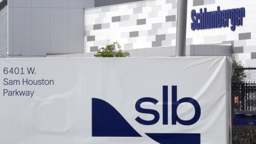 A sign for SLB, formerly Schlumberger, is displayed at the building on Tuesday, March 21, 2023, in Houston. Major American providers, the largest being SLB, of oilfield services supplied Russia with millions of dollars in equipment for months after its invasion of Ukraine, helping to sustain a critical part of its economy even as Western nations launched sanctions aimed at starving the Russian war effort. (AP Photo/David J. Phillip)