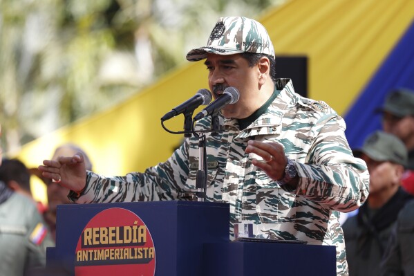 Venezuela's President Nicolas Maduro speaks during a rally marking the 22nd anniversary of the late President Hugo Chavez's return to power after a failed coup attempt, in Caracas, Venezuela, Saturday, April 13, 2024. (AP Photo/Pedro Rances Mattey)