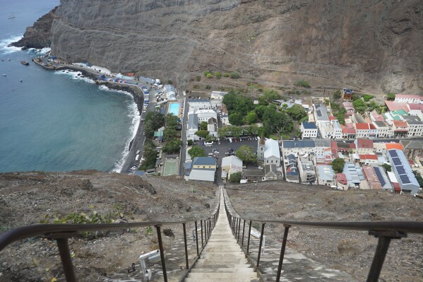 The city of Jamestown is pictured from the top of Jacob’s Ladder, a massive staircase carved into the side of a mountain on the remote island of St. Helena, Friday, Feb. 23, 2024. The 600-foot-high stairway was originally a donkey-powered cart track used to transport goods in and out of the city. (AP Photo/Nicole Evatt)