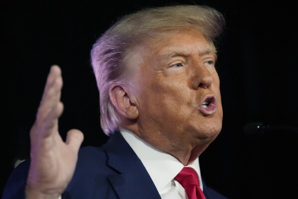 FILE - Former President Donald Trump speaks at a campaign event, July 8, 2023, in Las Vegas. Trump said Tuesday that he has received a letter informing him that he is a target of the Justice Department’s investigation into efforts to undo the results of the 2020 presidential election. Trump made the claim in a post on his Truth Social platform. (AP Photo/John Locher, File)