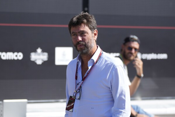 FILE - Juventus soccer team president Andrea Agnelli arrives prior to the start of the third free practice at the Monza racetrack, in Monza, Italy, Sept. 10, 2022. Former Juventus president Andrea Agnelli was banned from soccer for another 16 months on Monday July 10, 2023, after being charged with fraud for the way he handled player salary cuts during the coronavirus pandemic. (AP Photo/Luca Bruno, File)