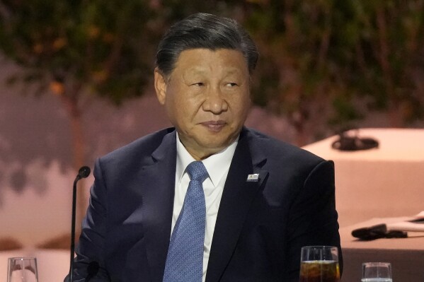 FILE - Chinese President Xi Jinping sits next to other world leaders during the Asia-Pacific Economic Cooperation (APEC) conference in San Francisco, on Nov. 16, 2023. Xi met at a state guesthouse in Beijing with the two European presidents, Ursula von der Leyen from the EU Commission and Charles Michel from the EU Council on Thursday, Dec. 7, 2023. (AP Photo/Jeff Chiu, File)