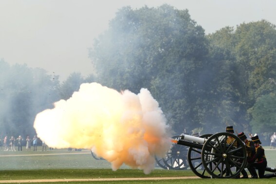 The King's Troop Royal Horse Artillery fire a 41 Gun Royal Salute supported by the Band of the Grenadier Guards, on the First anniversary of the death of Queen Elizabeth II, in Hyde Park, London, Friday, Sept. 8, 2023. With gun salutes and tolling bells, Britain is marking the first anniversary of the death of Queen Elizabeth II and the ascension of King Charles III, who remembered his mother as a symbol of stability during her 70-year reign. (AP Photo/Kirsty Wigglesworth)