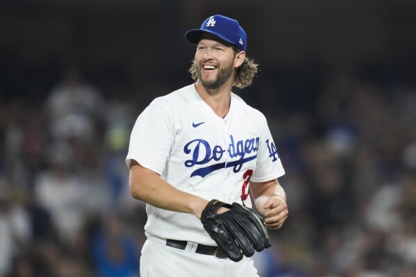Los Angeles Dodgers starting pitcher Clayton Kershaw (22) reacts after left fielder David Peralta caught a line drive hit by San Francisco Giants' Austin Slater during the fifth inning of a baseball game in Los Angeles, Saturday, Sept. 23, 2023. (AP Photo/Ashley Landis)