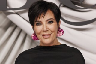 FILE - Kris Jenner appears at the Business of Fashion 500 Gala in Paris on Sept. 30, 2023. Jenner will appear in an ad for Oreo which will air at the Super Bowl. (AP Photo/Vianney Le Caer, File)