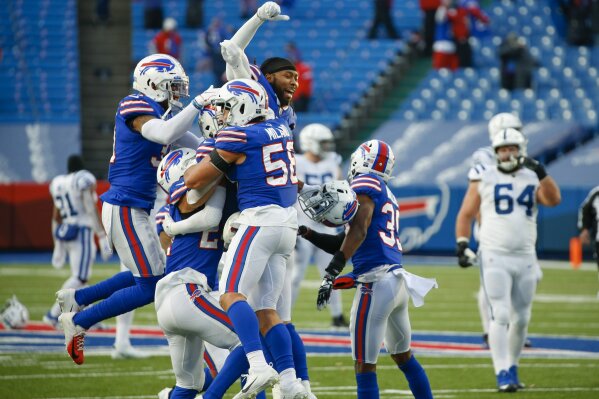 Buffalo Bills' Matt Milano (58) celebrates with teammates after an NFL wild-card playoff football game against the Indianapolis Colts Saturday, Jan. 9, 2021, in Orchard Park, N.Y. The Bills won the game 27-24. (AP Photo/Jeffrey T. Barnes)
