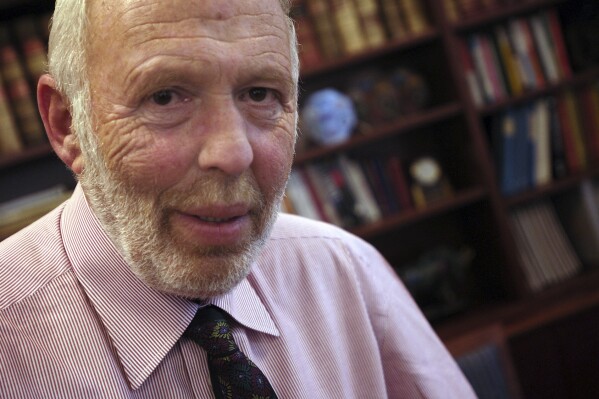 FILE - Jim Simons, a businessman and founder of Math for America, poses at his New York office, Wednesday, Dec. 14, 2005. Simons, a renowned mathematician and pioneering investor who built a fortune on Wall Street and then became one of the nation's biggest philanthropists, died Friday, May 10, 2024. He was 86. (AP Photo/Jason DeCrow, File)