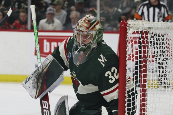 FILE - Minnesota Wild goaltender Filip Gustavsson (32) defends the net against against the Dallas Stars during the second period of Game 4 of an NHL hockey Stanley Cup first-round playoff series Sunday, April 23, 2023, in St. Paul, Minn. The Minnesota Wild signed goalie Filip Gustavsson to a three-year, $11.25 million contract on Monday, July 31, 2023, avoiding salary arbitration after his strong first season with the club. (AP Photo/Stacy Bengs, File)