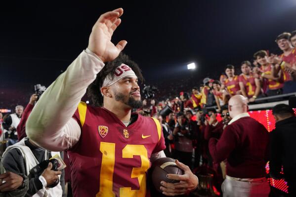 Southern California quarterback Caleb Williams waves to fans after USC defeated Notre Dame 38-27 an NCAA college football game Saturday, Nov. 26, 2022, in Los Angeles. (AP Photo/Mark J. Terrill)
