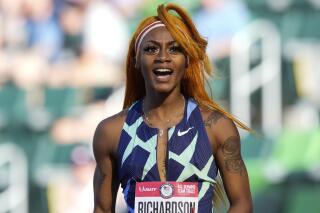 In this June 19, 2021 photo, Sha'Carri Richardson celebrates after winning the first heat of the semis finals in women's 100-meter runat the U.S. Olympic Track and Field Trials in Eugene, Ore.    Richardson cannot run in the Olympic 100-meter race after testing positive for a chemical found in marijuana.  Richardson, who won the 100 at Olympic trials in 10.86 seconds on June 19, told of her ban Friday, July 2 on the “Today Show.”(AP Photo/Ashley Landis)