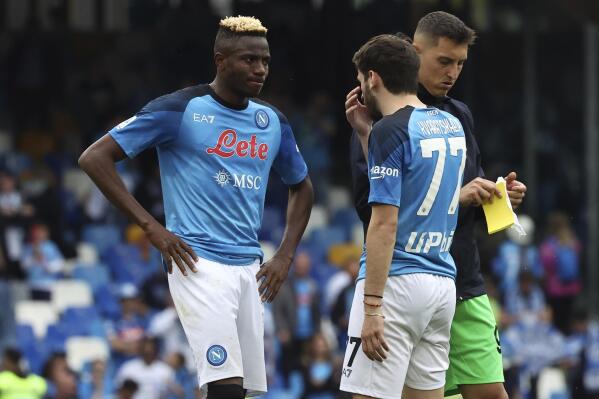 Napoli's Victor Osimhen, left, reacts after the Serie A soccer match between Napoli and Salernitana, at the Diego Armando Maradona stadium in Naples, Italy, Sunday, April 30, 2023. The match ended in a 1-1 draw. (Alessandro Garofalo/LaPresse via AP)