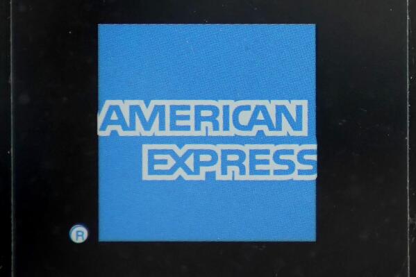 FILE - An American Express logo is attached to a door in Boston's Seaport District, Wednesday, July 21, 2021. American Express reports earnings on Friday, Jan. 27, 2023. (AP Photo/Steven Senne)