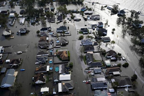 FILE - Homes are flooded in the aftermath of Hurricane Ida, Aug. 30, 2021, in Jean Lafitte, La. National Oceanic and Atmospheric Administration on Thursday, May 25, 2023, announced its forecast for the 2023 hurricane season. (AP Photo/David J. Phillip, File)
