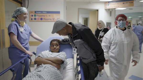 In this image from video provided by the Children’s Hospital of Philadelphia, an 11-year-old boy who was born with hereditary deafness prepares for a gene therapy procedure in Philadelphia in October 2023. On Tuesday, Jan. 23, 2024, the hospital announced his hearing has improved enough that he now has only mild to moderate hearing loss in the ear that was treated, and is hearing sound for the first time in his life. (Children’s Hospital of Philadelphia via AP)