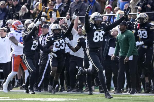 Vanderbilt defensive end Michael Owusu (88) celebrates after Jaylen Mahoney (23) intercepted a pass against Florida in the second half of an NCAA college football game Saturday, Nov. 19, 2022, in Nashville, Tenn. Vanderbilt won 31-24. (AP Photo/Mark Humphrey)