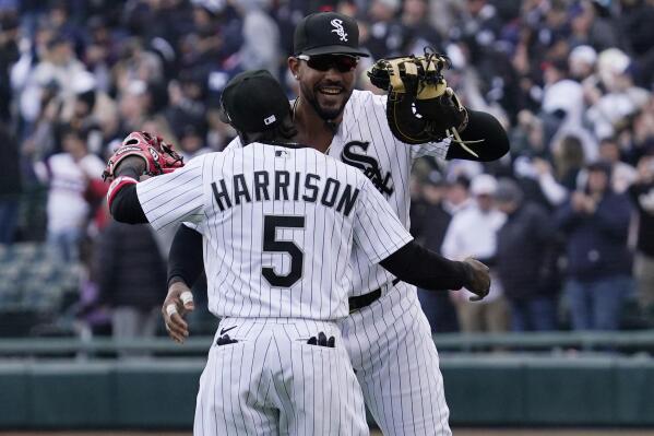 Chicago White Sox first baseman Jose Abreu, right, celebrates with third baseman Josh Harrison after they defeated the Tampa Bay Rays in a baseball game in Chicago, Saturday, April 16, 2022. (AP Photo/Nam Y. Huh)