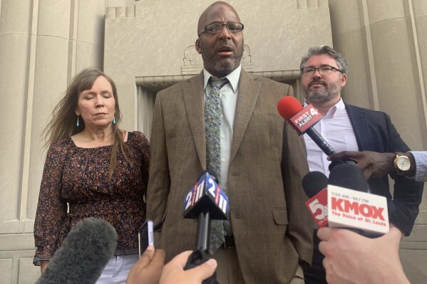 Christopher Dunn stands free after his murder conviction was overturned after 34 years behind bars, on the steps of a courthouse in downtown St. Louis, Tuesday, July 30, 2024. (Laurie Skrivan/St. Louis Post-Dispatch via AP)