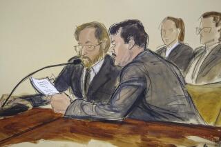 FILE  - In this courtroom sketch, Joaquin "El Chapo" Guzman, foreground right, reads a statement through an interpreter during his sentencing in federal court, July 17, 2019, in New York. A US appeals court affirmed on Tuesday, Jan. 25, 2022 the conviction of Joaquín “El Chapo” Guzmán, who had asked for his 2019 indictment for drug trafficking to be dismissed. (Elizabeth Williams via AP, File)