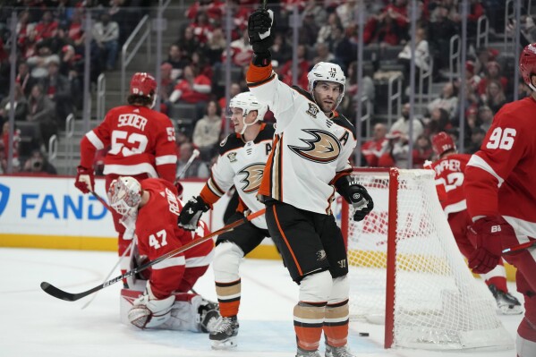 Anaheim Ducks center Adam Henrique (14) reacts after his goal on Detroit Red Wings goaltender James Reimer (47) during the first period of an NHL hockey game, Monday, Dec. 18, 2023, in Detroit. (AP Photo/Carlos Osorio)