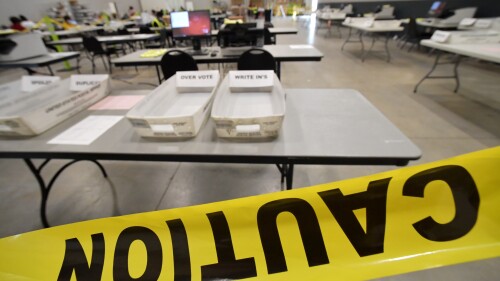 FILE - In this Tuesday, Nov. 24, 2020, file, photo, Cobb County Election officials prepare for a recount of ballots in Marietta, Ga. The Georgia State Election Board is asking a judge to order Texas-based True the Vote group, a conservative voting organization, to produce information to help investigate its claims of ballot trafficking in the state. In the court filing Tuesday, July 11, 2023,the state attorney general’s office asked a Fulton County Superior Court judge to order True the Vote to comply with its subpoena. (AP Photo/Mike Stewart)