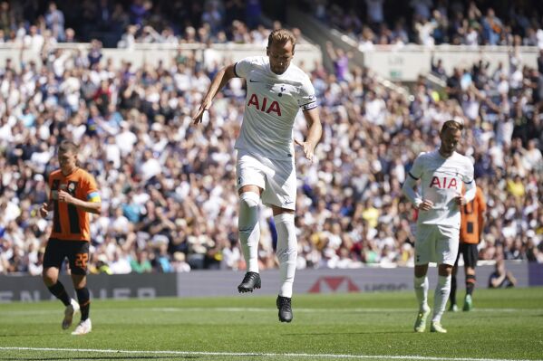 Tottenham Hotspur's Harry Kane celebrates scoring his side's first goal of the game from the penalty spot during the pre-season friendly soccer match between Tottenham and Shakhtar Donetsk, at the Tottenham Hotspur Stadium, London Sunday August 6, 2023. (Yui Mok/PA via AP)