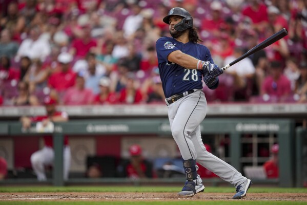 FILE - Seattle Mariners' Eugenio Suarez bats during a baseball game against the Cincinnati Reds in Cincinnati, Monday, Sept. 4, 2023. The Arizona Diamondbacks acquired slugger Eugenio Suárez on Wednesday, Nov. 22, from Mariners for reliever Carlos Vargas and catcher Seby Zavala. (AP Photo/Aaron Doster, File)