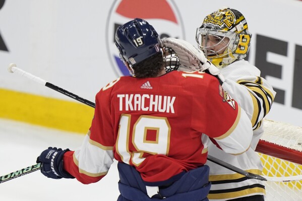 Florida Panthers left wing Matthew Tkachuk (19) and Boston Bruins goaltender Jeremy Swayman scuffle during the second period of Game 1 of the second-round series of the Stanley Cup Playoffs, Monday, May 6, 2024, in Sunrise, Fla. (AP Photo/Wilfredo Lee)