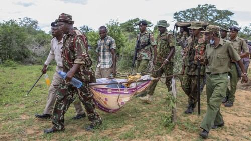 FILE - Police and local residents load the exhumed bodies of victims of a religious cult into the back of a truck in the village of Shakahola, near the coastal city of Malindi, in southern Kenya on April 23, 2023. The number of people who died after a Kenyan pastor ordered his followers to starve to death in order to meet Jesus is at more than 300, authorities said Tuesday June 13, 2023, and the death toll is expected to rise as more exhumations are planned. (AP Photo, File)